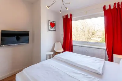 Ein Bett oder Betten in einem Zimmer der Unterkunft Ferienwohnung Großes Schützenchalet mit 25 qm Dachterrasse