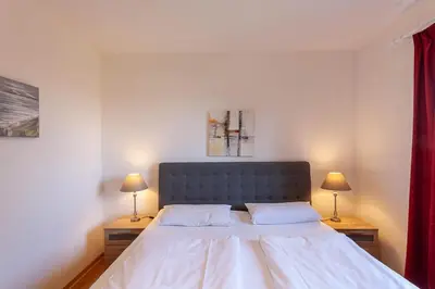 Ein Bett oder Betten in einem Zimmer der Unterkunft Ferienwohnung Harzer Glück mit Balkon und Sauna
