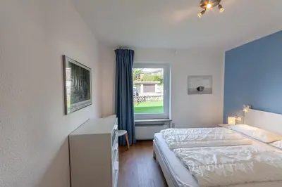 Ein Bett oder Betten in einem Zimmer der Unterkunft Ferienwohnung Auf dem Hügel mit Balkon