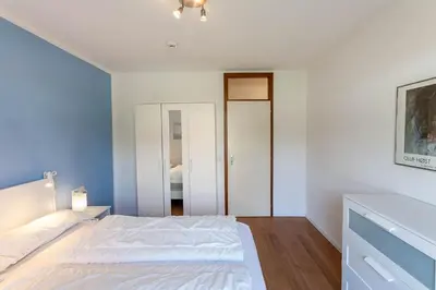 Ein Bett oder Betten in einem Zimmer der Unterkunft Ferienwohnung Auf dem Hügel mit Balkon