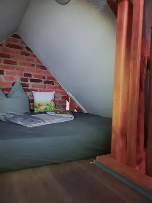 Ein Bett oder Betten in einem Zimmer der Unterkunft Im Harzer Vogelnest Finkennest