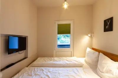 Ein Bett oder Betten in einem Zimmer der Unterkunft Ferienwohnung Lichtblick mit Balkon und Garage
