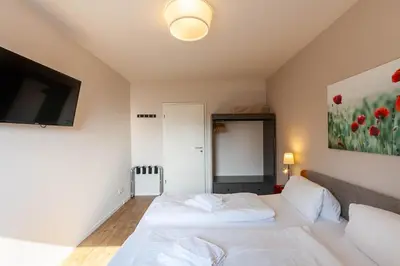 Ein Bett oder Betten in einem Zimmer der Unterkunft Ferienwohnung Lichtblick mit Balkon und Garage
