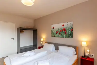 Ein Bett oder Betten in einem Zimmer der Unterkunft Ferienwohnung Lichtblick mit Balkon und Garage
