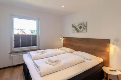 Ein Bett oder Betten in einem Zimmer der Unterkunft Ferienwohnung Bergsicht mit Balkon