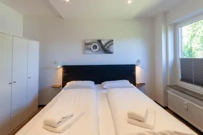 Ein Bett oder Betten in einem Zimmer der Unterkunft Ferienwohnung Bergsicht mit Balkon