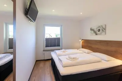 Ein Bett oder Betten in einem Zimmer der Unterkunft Ferienwohnung Bergsicht mit Balkon