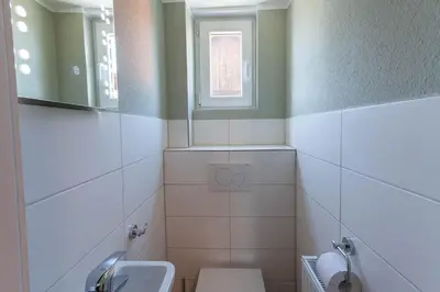 Ein Badezimmer in der Unterkunft Ferienwohnung Waldfrieden 4 mit Dachterrasse und Grill