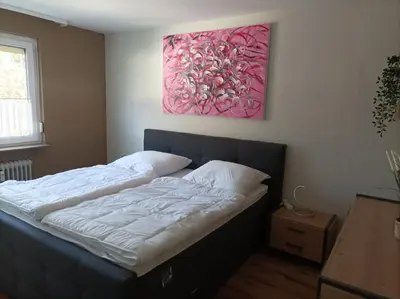 Ein Bett oder Betten in einem Zimmer der Unterkunft Blankenburgerstr 8b FeWo Batian am Waldesrand