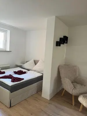Ein Bett oder Betten in einem Zimmer der Unterkunft FW Neustadt Hunde willkommen