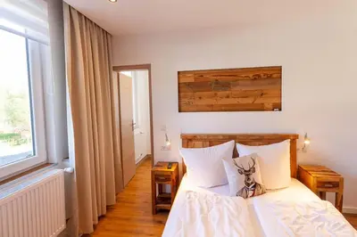 Ein Bett oder Betten in einem Zimmer der Unterkunft Ferienwohnung Waldfrieden 3 mit Dachterrasse und Grill
