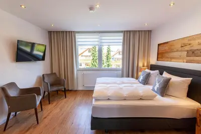 Ein Bett oder Betten in einem Zimmer der Unterkunft Ferienwohnung Waldfrieden 3 mit Dachterrasse und Grill