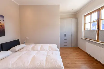 Ein Bett oder Betten in einem Zimmer der Unterkunft Ferienwohnung Waldfrieden 2 mit Garten und Grill