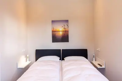 Ein Bett oder Betten in einem Zimmer der Unterkunft Ferienwohnung Waldfrieden 2 mit Garten und Grill