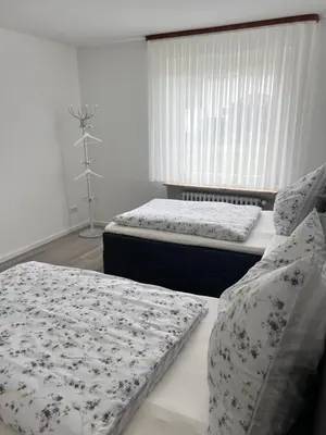 Ein Bett oder Betten in einem Zimmer der Unterkunft FeWo Aue