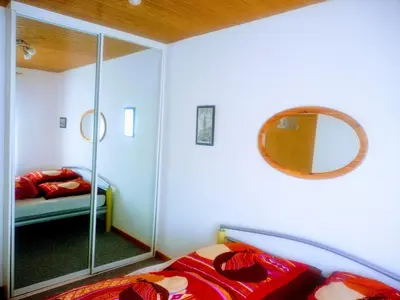 Ein Bett oder Betten in einem Zimmer der Unterkunft Hexenstube Morgana ,WLAN, tolles Bad, Garage, toller Balkon