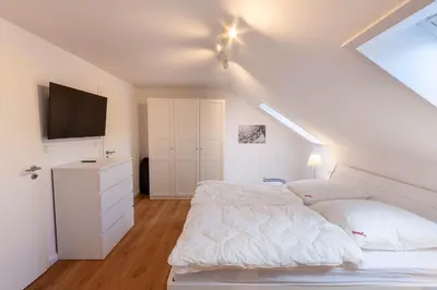 Ein Bett oder Betten in einem Zimmer der Unterkunft Ferienwohnung Blickfang mit Balkon und Traumblick