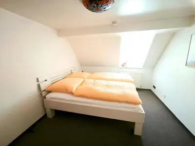 Ein Bett oder Betten in einem Zimmer der Unterkunft Die Brockenstube