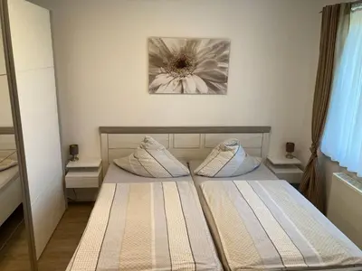 Ein Bett oder Betten in einem Zimmer der Unterkunft Ferienwohnung Huyblick
