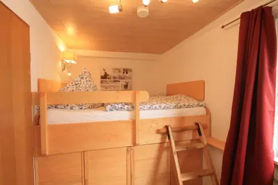 Ein Bett oder Betten in einem Zimmer der Unterkunft Ferienwohnung Hexenbaude