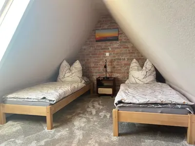 Ein Bett oder Betten in einem Zimmer der Unterkunft Ferienwohnung Glück Auf