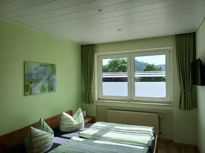 Ein Bett oder Betten in einem Zimmer der Unterkunft Haus Nietmann Kleine gemütliche Ferienwohnung mit modernen Akzenten