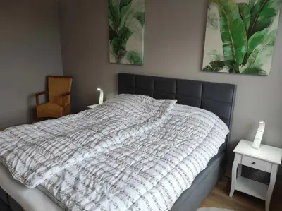 Ein Bett oder Betten in einem Zimmer der Unterkunft Ferienwohnung Penthouse Bummelallee