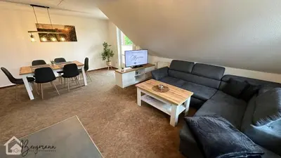 Ein Sitzbereich in der Unterkunft Ferienwohnung Bergmann mit Balkon und Kamin