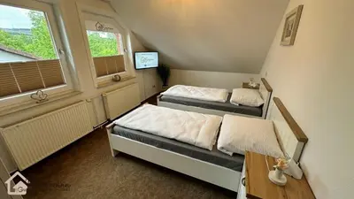 Ein Bett oder Betten in einem Zimmer der Unterkunft Ferienwohnung Bergmann mit Balkon und Kamin