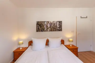 Ein Bett oder Betten in einem Zimmer der Unterkunft Ferienwohnung BergTräumchen mit Sauna und Balkon