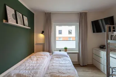 Ein Bett oder Betten in einem Zimmer der Unterkunft Ferienwohnung Somnia mit Balkon