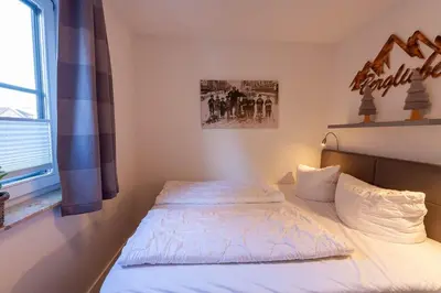 Ein Bett oder Betten in einem Zimmer der Unterkunft Kleine Bergsuite mit Terrasse