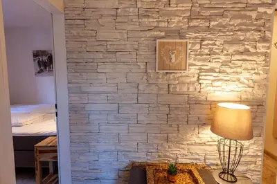 Ein Bett oder Betten in einem Zimmer der Unterkunft Kleine Bergsuite mit Terrasse