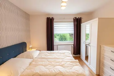 Ein Bett oder Betten in einem Zimmer der Unterkunft Ferienwohnung Bergfreude mit Balkon