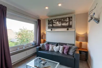 Ein Sitzbereich in der Unterkunft Ferienwohnung Harzlaune mit Balkon und Wurmbergblick