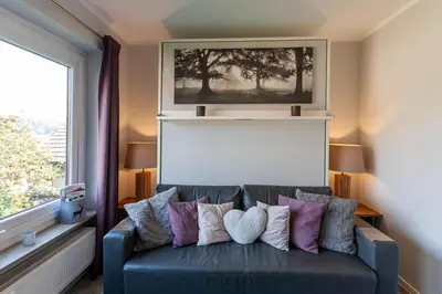 Ein Sitzbereich in der Unterkunft Ferienwohnung Harzlaune mit Balkon und Wurmbergblick