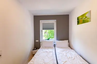 Ein Bett oder Betten in einem Zimmer der Unterkunft Ferienwohnung Bergkristall mit Balkon
