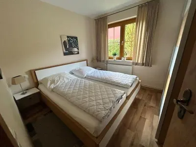 Ein Bett oder Betten in einem Zimmer der Unterkunft Ferienwohnung Kleine Auszeit