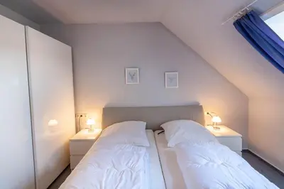 Ein Bett oder Betten in einem Zimmer der Unterkunft Ferienwohnung Wurmberg Ausblick mit Balkon