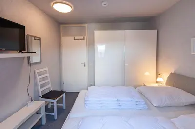 Ein Bett oder Betten in einem Zimmer der Unterkunft Ferienwohnung Wurmberg Ausblick mit Balkon