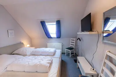 Ein Bett oder Betten in einem Zimmer der Unterkunft Ferienwohnung Wurmberg Ausblick mit Balkon