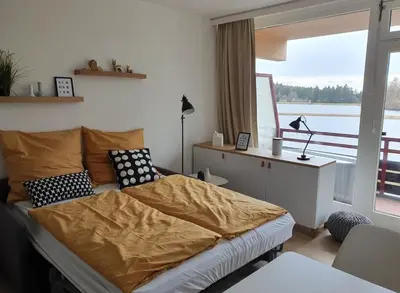 Ein Bett oder Betten in einem Zimmer der Unterkunft Lake Lodge am Kranichsee - Hahnenklee im Harz