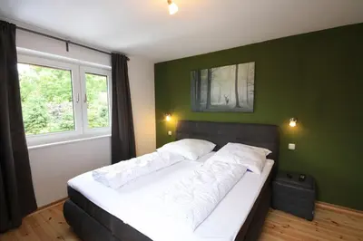 Ein Bett oder Betten in einem Zimmer der Unterkunft Ferienhaus Harzer Budenzauber mit Sauna