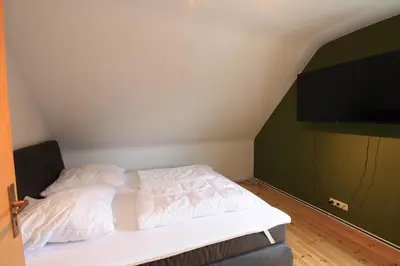 Ein Bett oder Betten in einem Zimmer der Unterkunft Ferienhaus Harzer Budenzauber mit Sauna