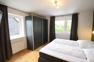 Ein Bett oder Betten in einem Zimmer der Unterkunft Ferienhaus Harzer Budenzauber mit Sauna