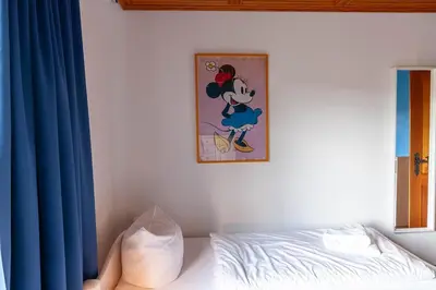 Ein Bett oder Betten in einem Zimmer der Unterkunft Ferienwohnung Carpe Diem mit Balkon