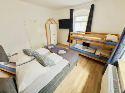 Ein Bett oder Betten in einem Zimmer der Unterkunft TraumFeWo Harmonie in Seenähe mit Terrasse von Harztraveler
