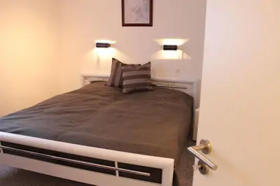 Ein Bett oder Betten in einem Zimmer der Unterkunft Ferienwohnung Arlt