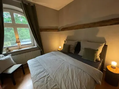 Ein Bett oder Betten in einem Zimmer der Unterkunft Bergrauschen-Waldbude in Goslar-Okertal im Harz inkl Wäsche