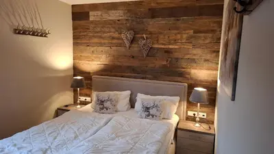 Ein Bett oder Betten in einem Zimmer der Unterkunft Ferienwohnung Kurparkglück